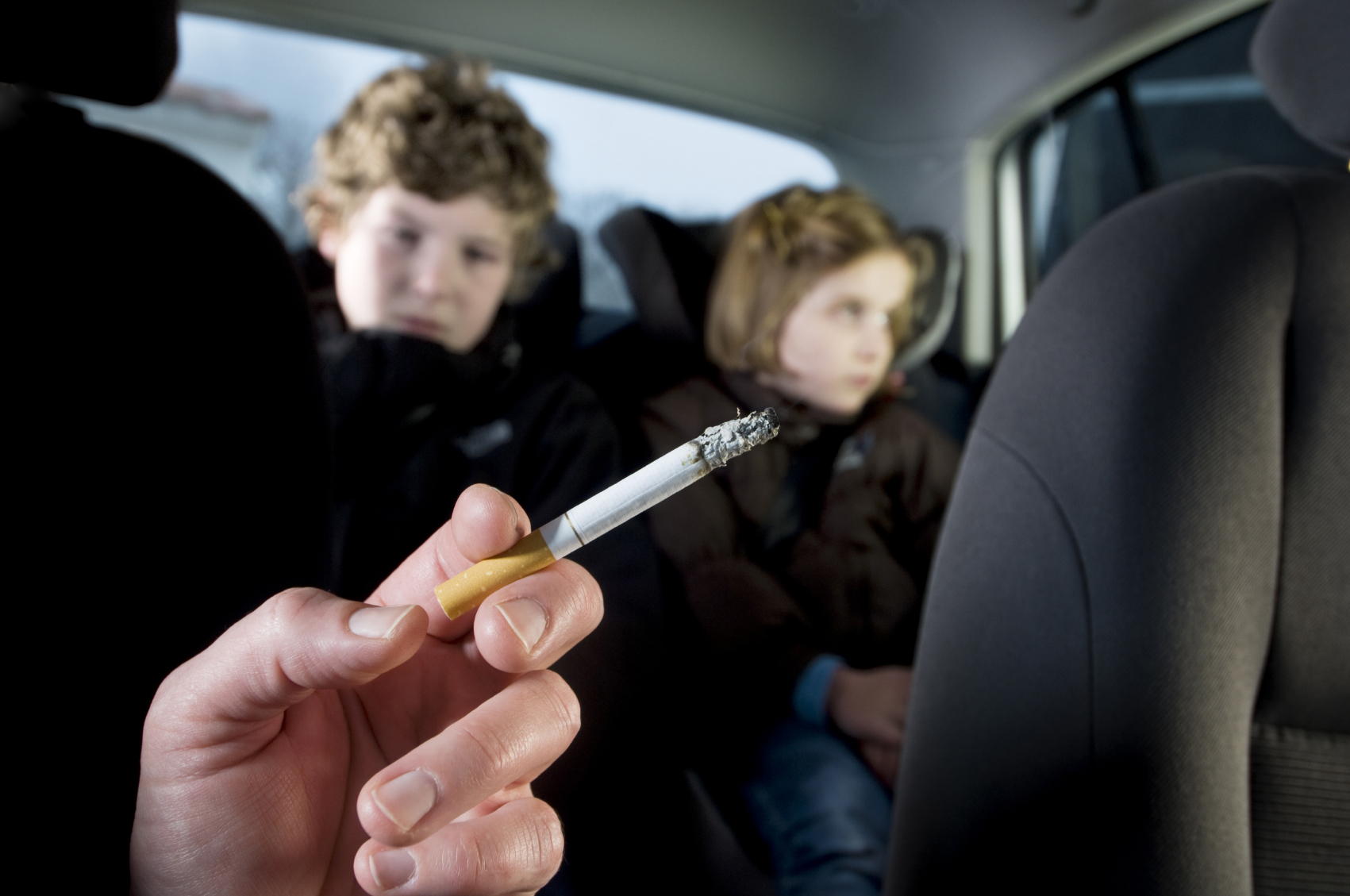 Children in a car passive smoking