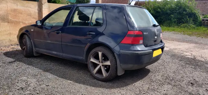 Worn out VW Golf parked